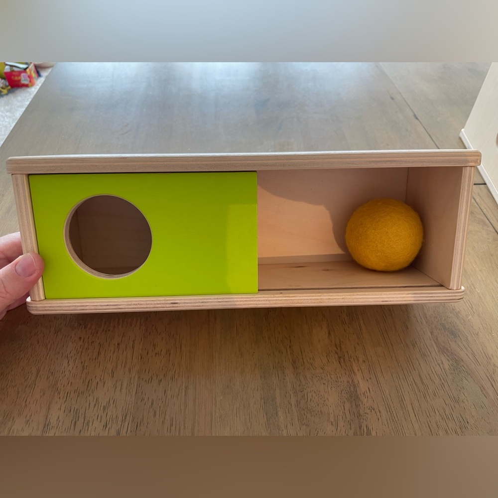 Lovevery Sliding Top Box with Yellow Ball